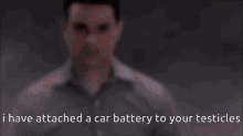 a man has attached a car battery to your testicles