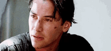keanu reeves tired wounded look away