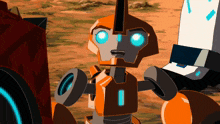 a cartoon robot with blue eyes is standing on a dirt field