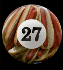 a bunch of hot dogs with the number 27 in the middle