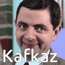 a close up of a man 's face with the name kafkaz written on it