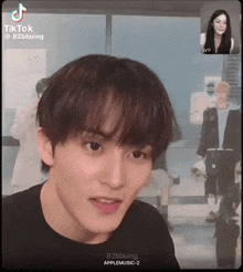 a man and a woman are talking on a video call .
