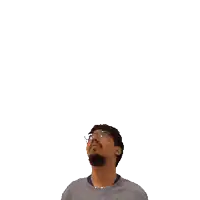 a man with glasses and a beard looks up at the number 23