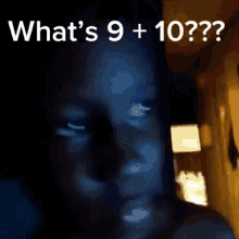 a blurred image of a person with the words " what 's 9 + 10 "