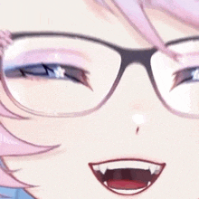 a close up of a girl wearing glasses and making a face .