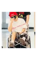 a person in a wheelchair with the words scoops military evader written on their shirt