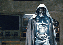a statue of a man wearing a hooded cape and a mask