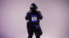 a man wearing a blue and black ultra hoodie