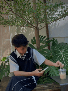 a person wearing a vest that says ' saigon ' on it