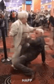 a man and a woman are dancing in a casino .
