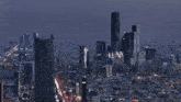 an aerial view of a city at night with a few buildings that say ' www ' on them