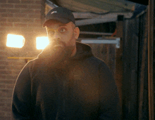 a man with a beard wearing a hat that says oreal on it