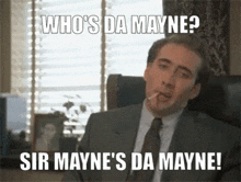 a man in a suit and tie smoking a cigarette with a caption that says who 's da mayne sir mayne
