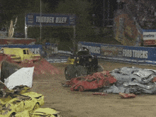 a monster truck is driving through a thunder alley
