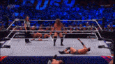 a wrestler is standing in the middle of a wrestling ring with a aew logo on the side