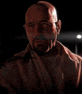 a man with glasses and a beard says run in a dark room