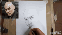 a drawing of a man 's face is being made by animatica