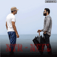 two men standing next to each other with an umbrella in front of a sign that says kvvcsr