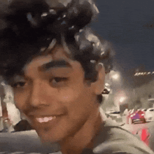 a close up of a young man 's face with a blurred background