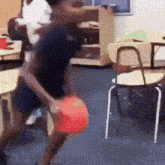 a blurry picture of a person holding a red ball