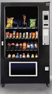 a vending machine with a bag of sun chips in the middle
