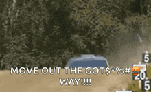a car is driving down a dirt road with the words move out the got $ % # way written on it .
