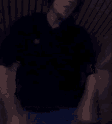 a blurry picture of a man wearing headphones in a dark room