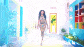 a woman in a bikini is walking down a hallway in a colorful room .
