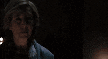 a bright blue light is shining through a dark blue sky