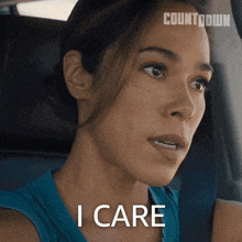 a woman sitting in a car with the words i care above her