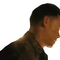 a man with a tattoo on his neck is looking down