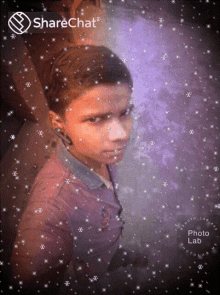 a boy 's face is surrounded by snowflakes and says sharechat