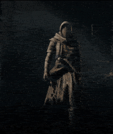 a hooded figure with a sword in his hand in a dark forest
