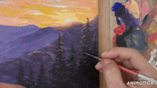 a person is painting a landscape with the words made in animotica visible