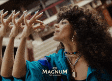 a woman with long nails and a magnum advertisement