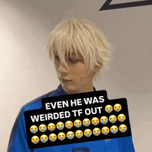 a man wearing a blue shirt is behind a sign that says even he was weirded tf out