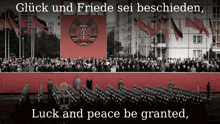 a large crowd of people are gathered in front of a large red banner that says luck and peace be granted