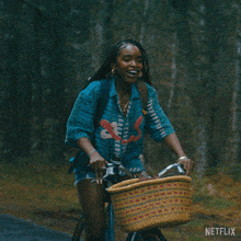 a woman is riding a bike with a basket and the word netflix on the bottom right