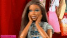 a blurry picture of a barbie doll with myfroggystuff written on the bottom right
