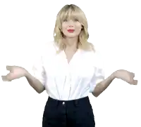 a blonde woman wearing a white shirt and black pants spreads her arms