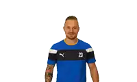 a man wearing a blue and black shirt with the number 23 on it