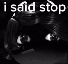 a black and white photo of a doll with the words " i said stop "