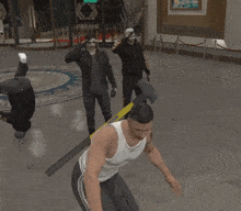 a man in a white tank top is holding an axe with a yellow handle that says ' stamina ' on it