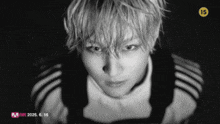 a black and white photo of a man with the number 15 on his head