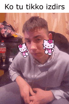 a man with hello kitty stickers on his face
