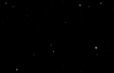 a blurry image of a person 's face with a black background