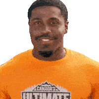 a man wearing an orange canada 's ultimate shirt smiles for the camera