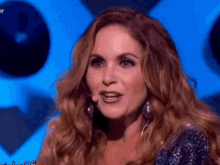 a close up of a woman 's face with a microphone in front of her .