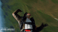 a poster for mission impossible the final reckoning shows a man in a parachute