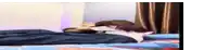 a person is laying on a bed with a pillow on their face .
